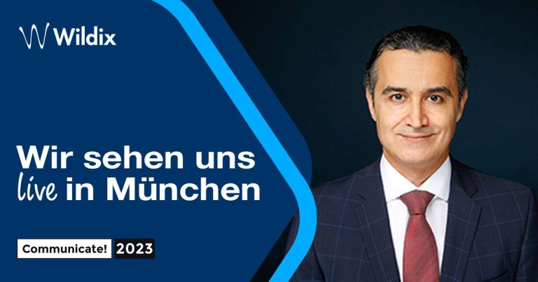 Mahmud Awad, Country Manager Deutschland & Österreich at Wildix, standing on the right, text on the left "Wir sehen uns live in München" (Communicate! 2023)